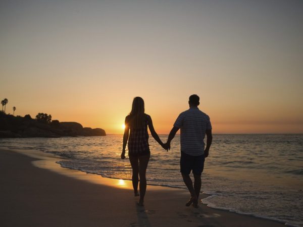 Couple walking on the beach